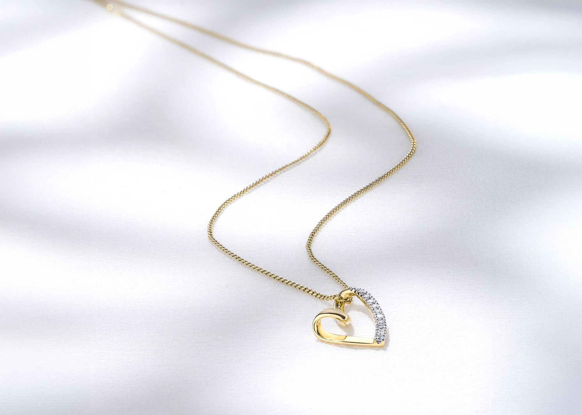 diamond heart pendant in yellow gold necklace