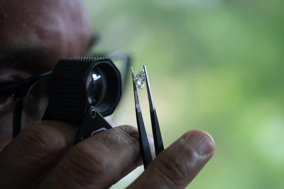 jeweller studying diamond