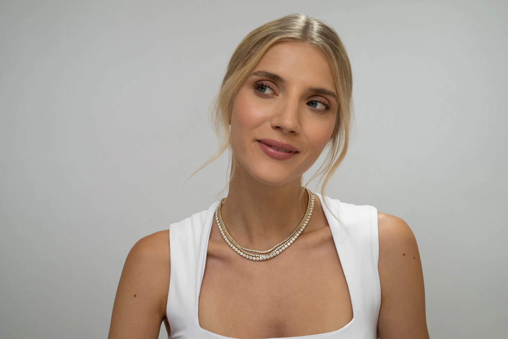 lady wearing diamond necklaces