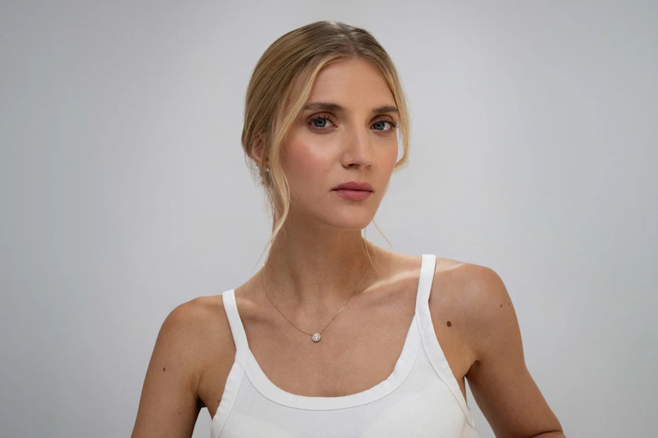 woman wearing yellow gold jewellery