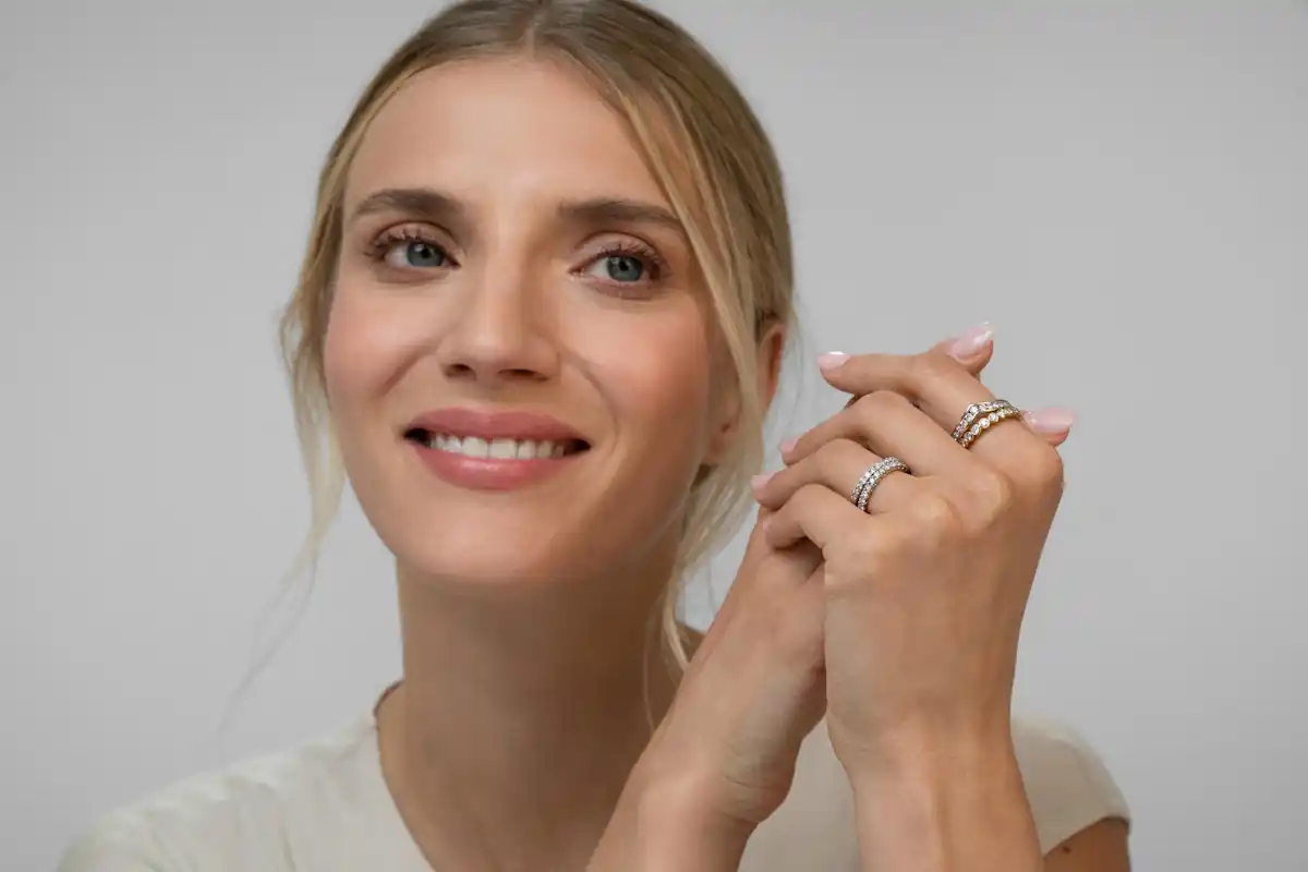 woman wearing vaious diamond rings