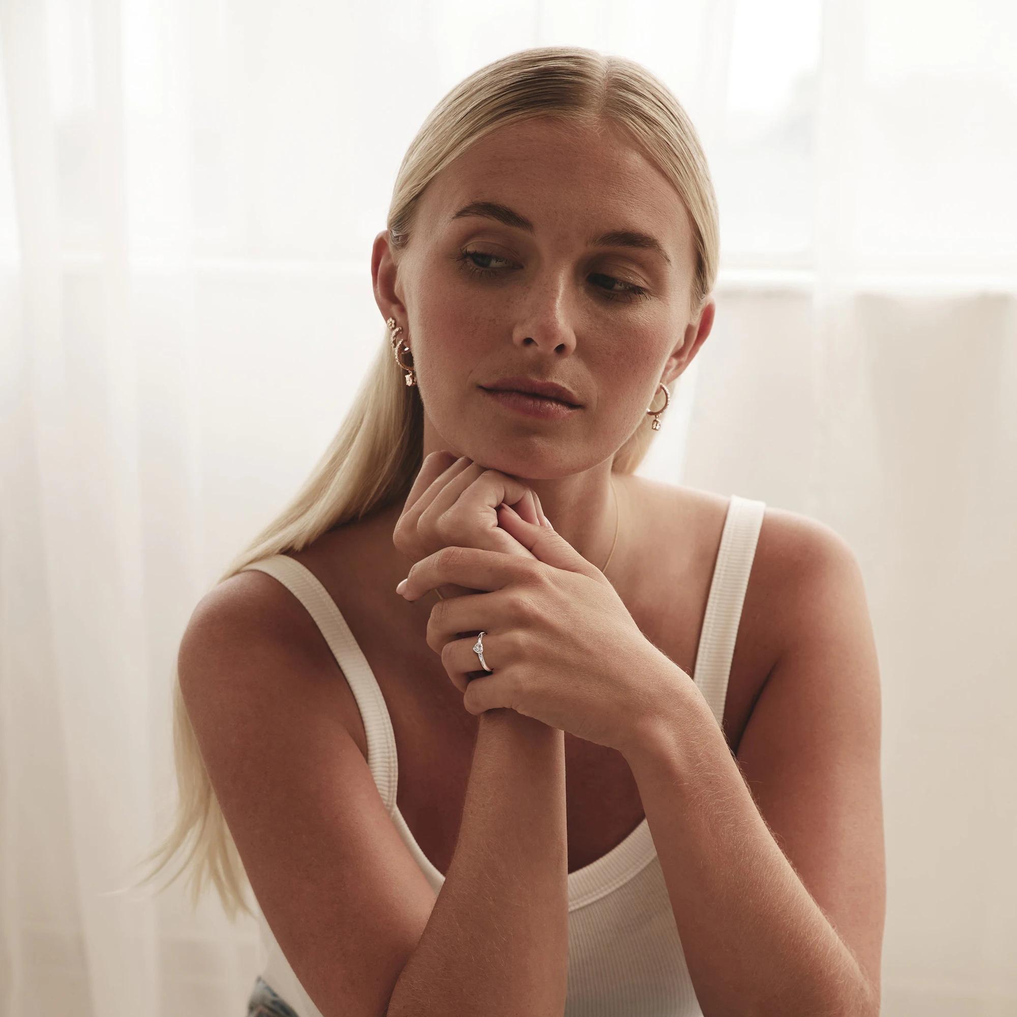 young woman wearing diamond jewellery