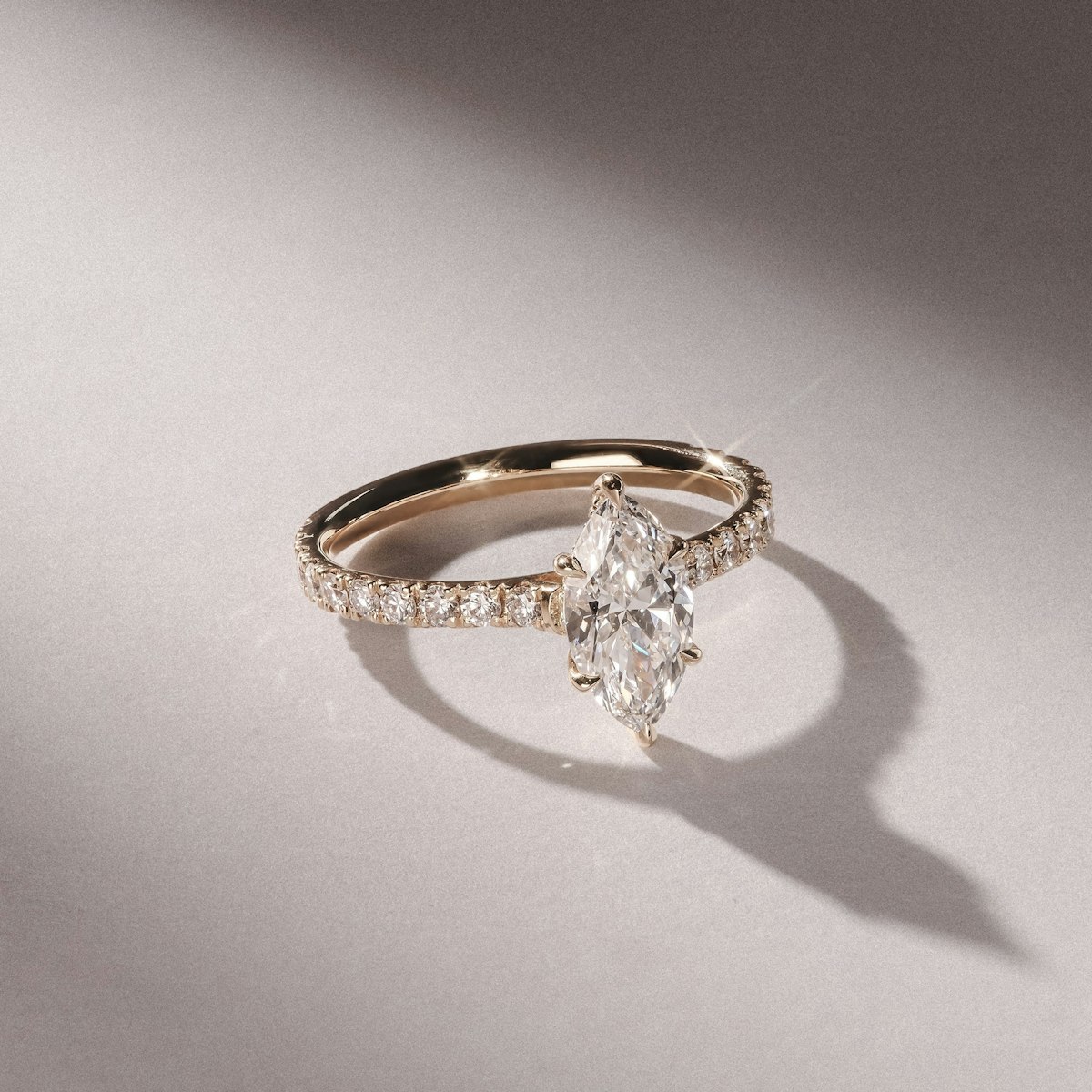 marquise cut diamond sidestones gold engagement ring