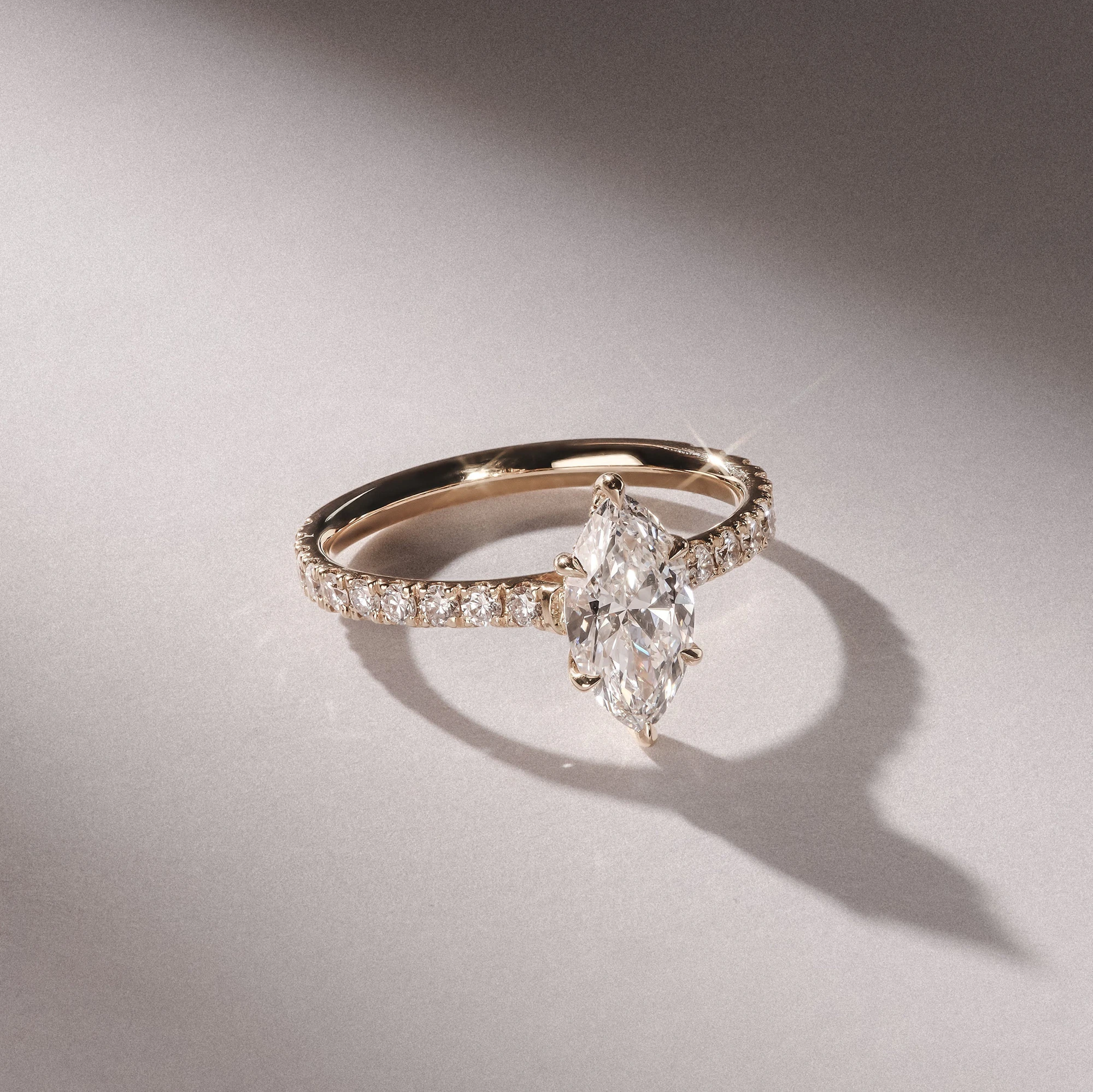 marquise cut diamond sidestones gold engagement ring