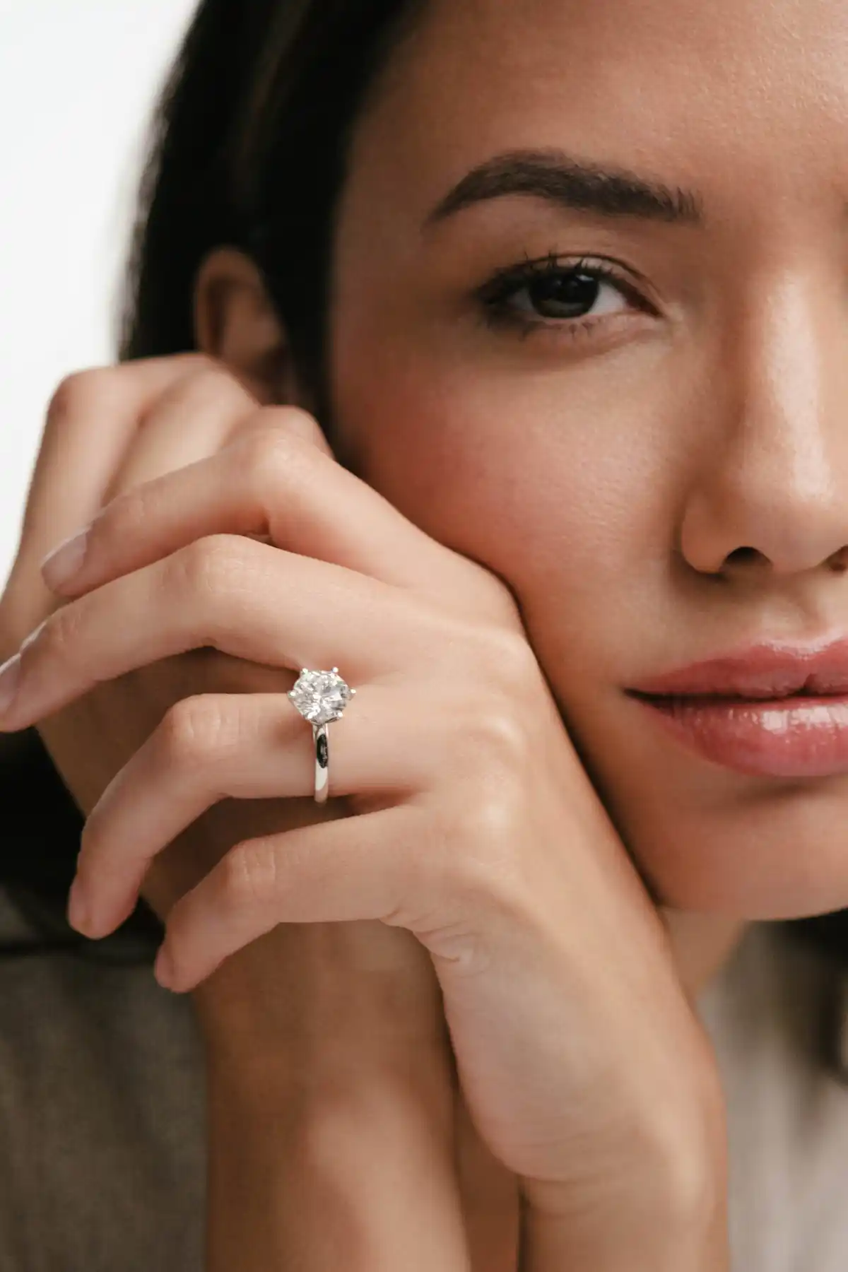woman wearing white gold diamond ring