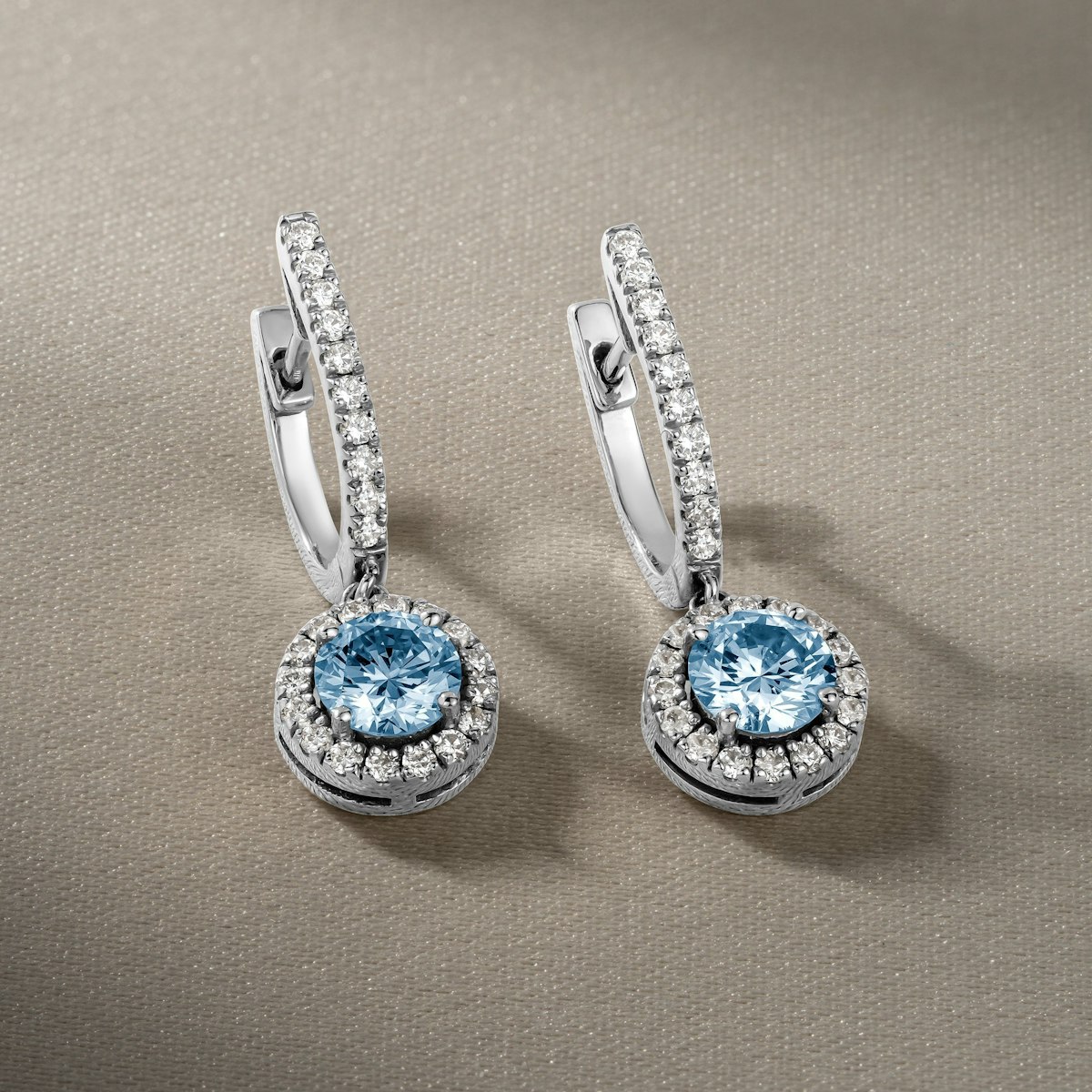 blue topaz and diamond halo drop earrings