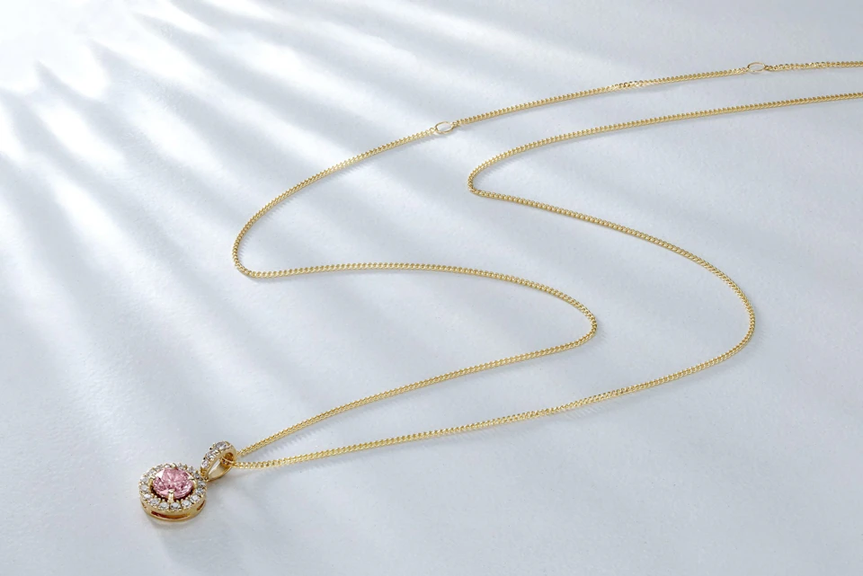 Gold necklace with pink stone