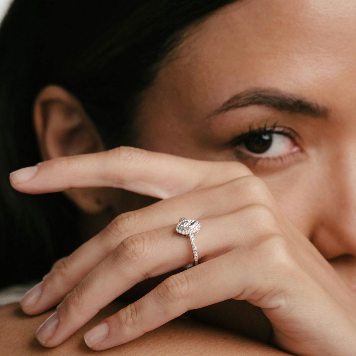 woman wearing marquise cut diamond engagement ring