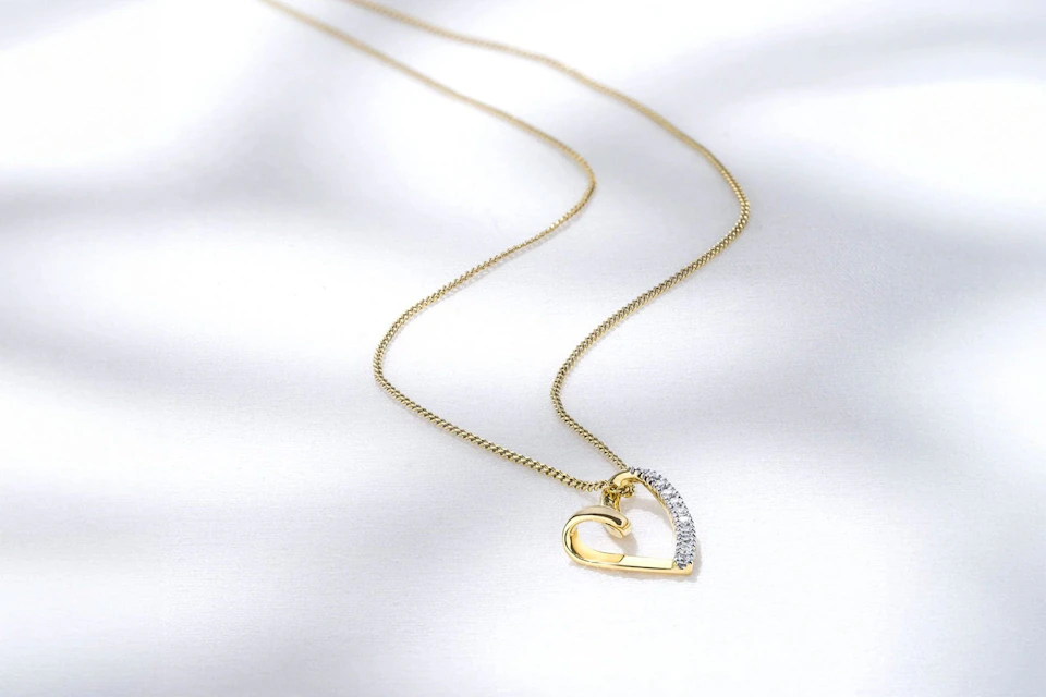 diamond heart pendant in yellow gold necklace
