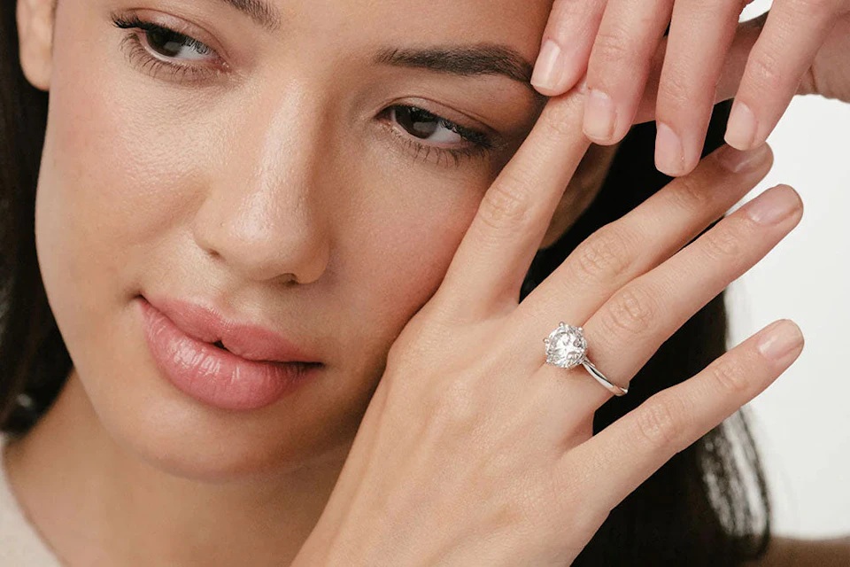 Lady wearing diamond ring on finger