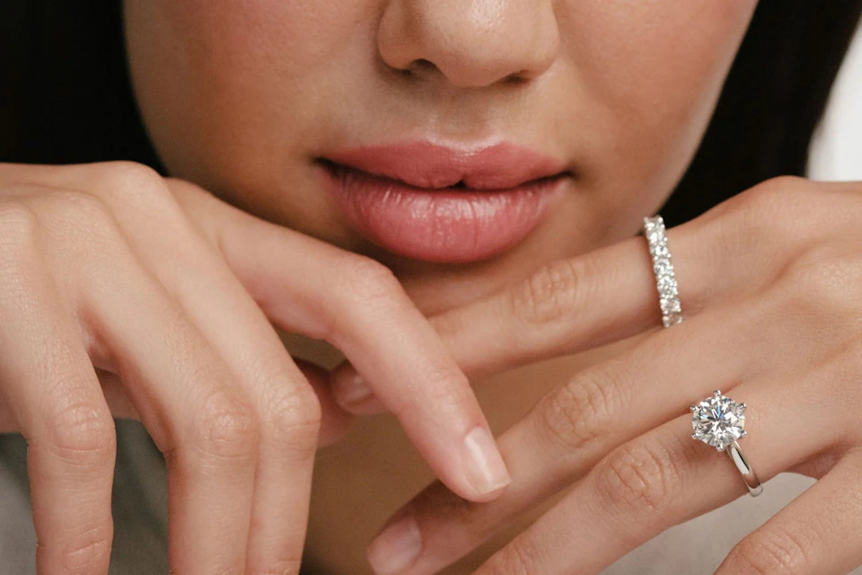 woman with diamond rings