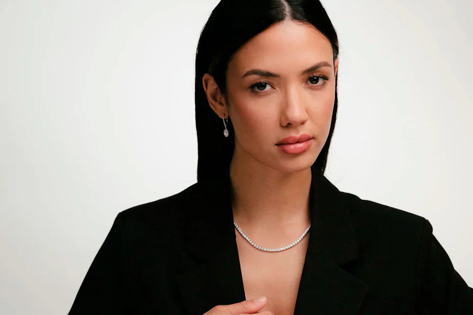 lady in black blazer wearing jewellery
