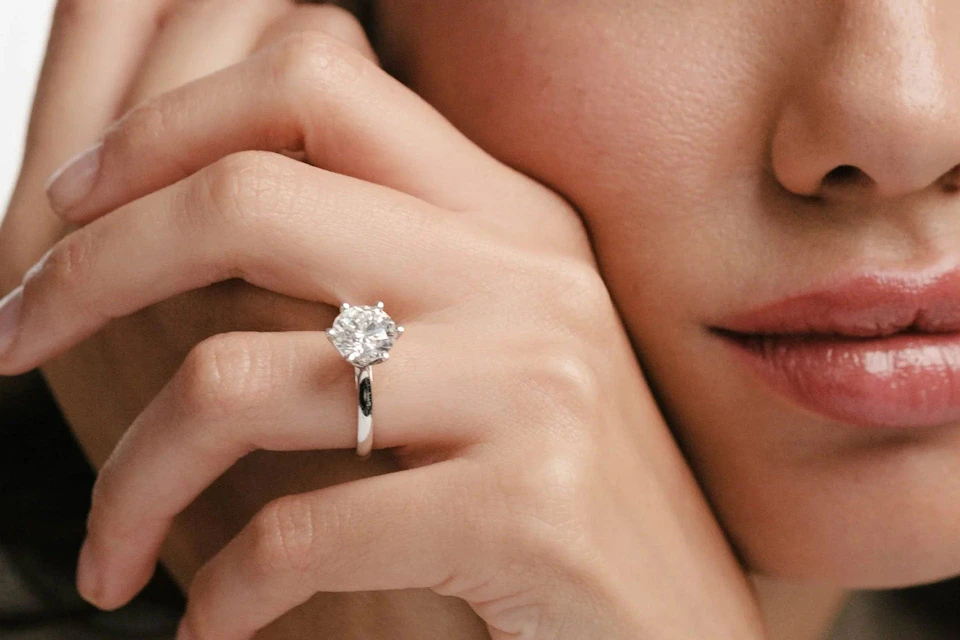 woman wearing white gold diamond ring