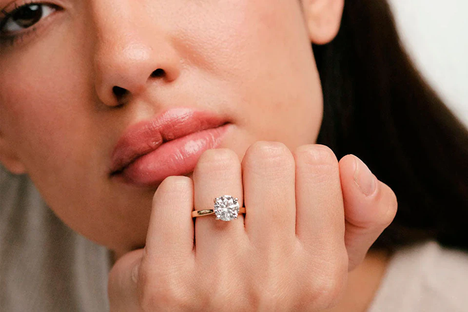 model wearing engagement ring