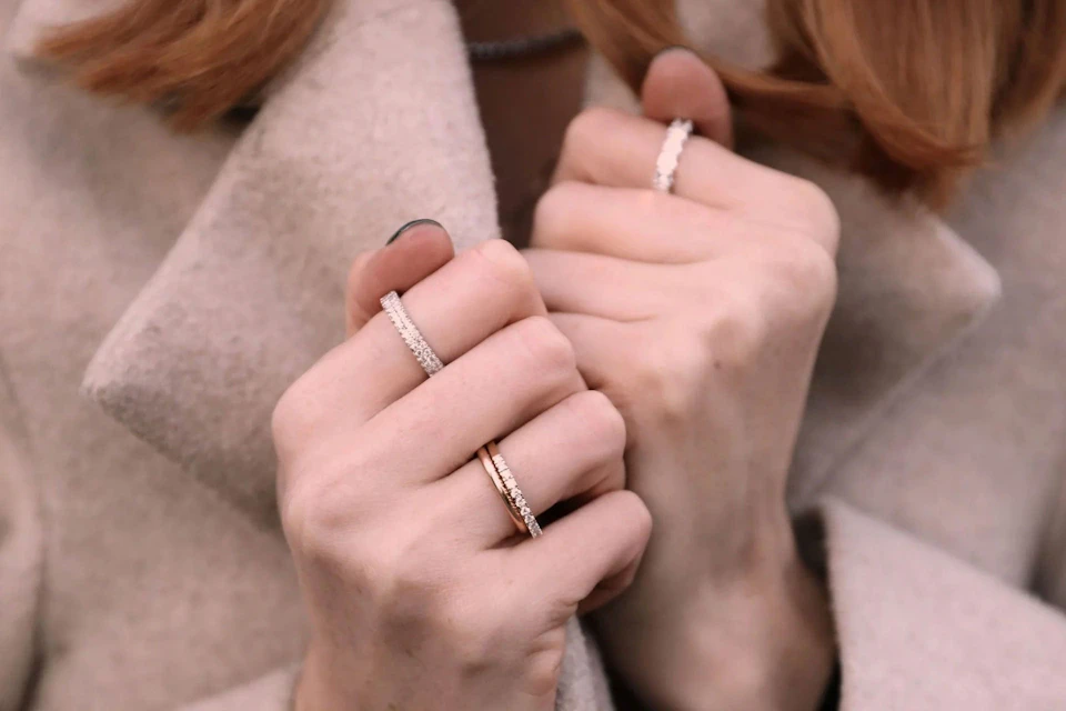 A lady wearing eternity rings