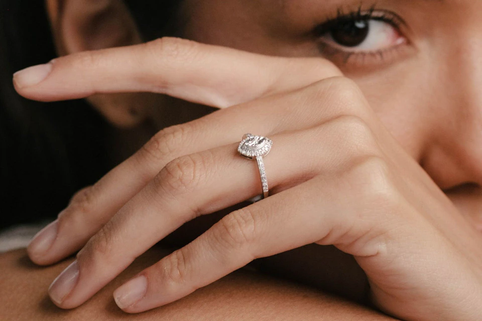 Woman wearing a marquise cut diamond ring