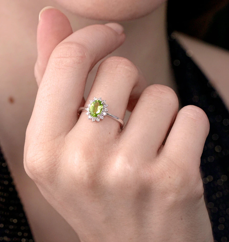 Peridot 7 x 5mm And Diamond 9K White Gold Ring