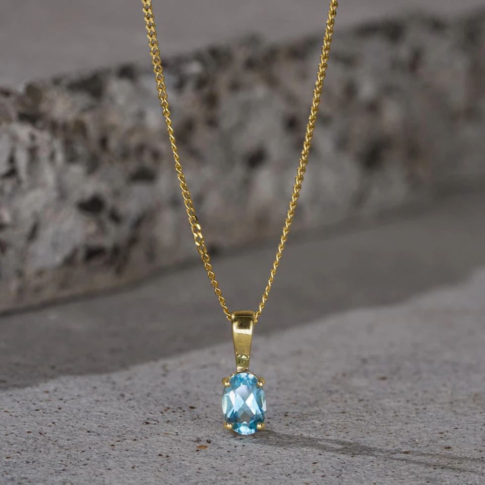 Blue Topaz 7 x 5mm 9K Yellow Gold Pendant Necklace