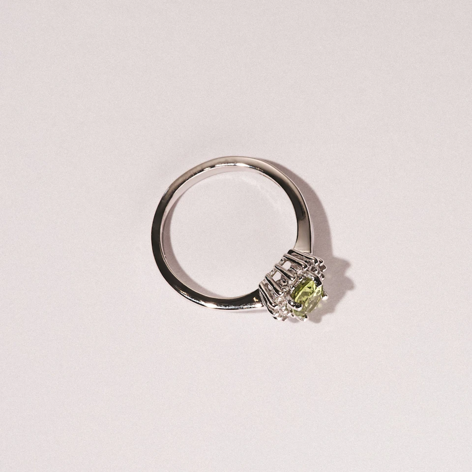 Peridot 7 x 5mm And Diamond 9K White Gold Ring