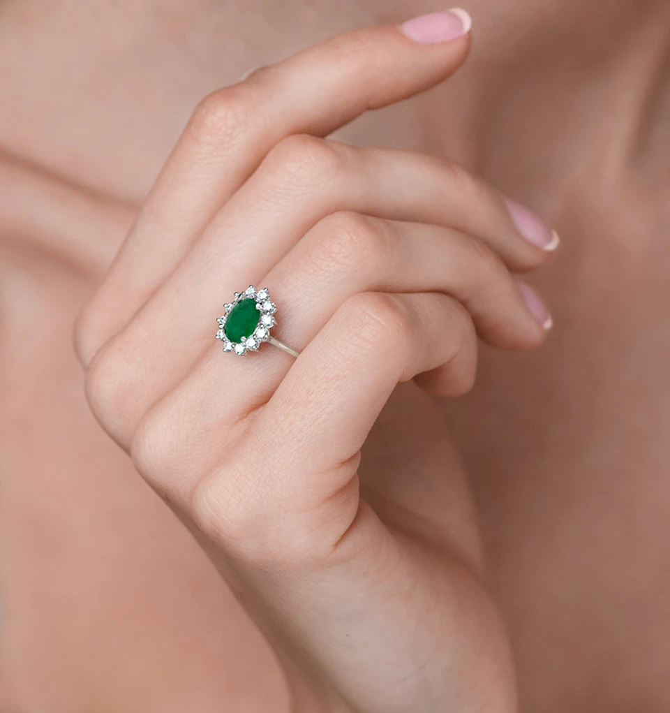 1.15ct Oval Cut Emerald and Lab Diamond Halo Ring in 9K White Gold