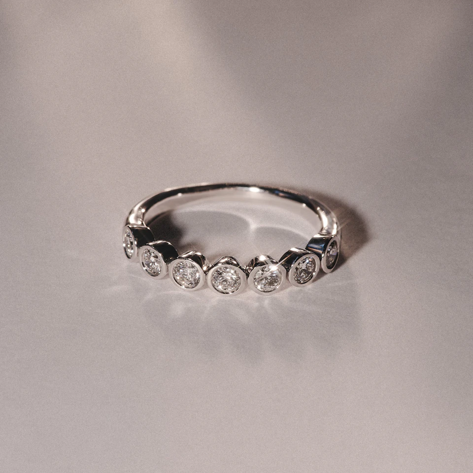 Orbit Half Band 0.15ct F/VS Round Cut Rubover Eternity Ring in 18K Silver