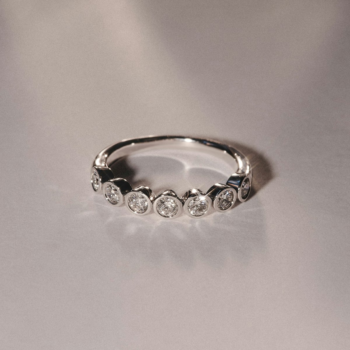 Orbit Half Band 0.30ct F/VS Round Cut Rubover Eternity Ring in 9K White Gold