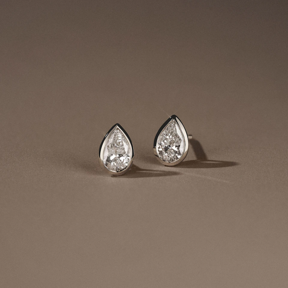 Bezel Set 1.00ct Pear Cut Lab Diamond Stud Earrings in 18K White Gold