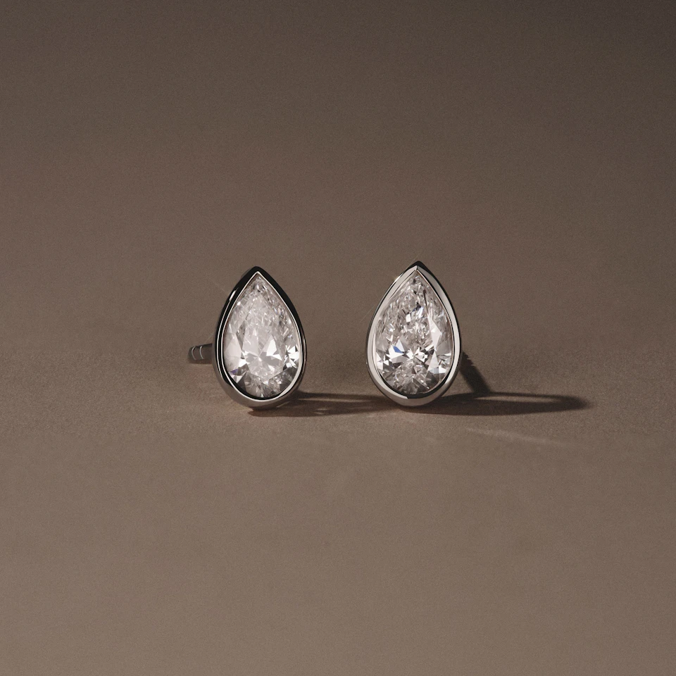 Bezel Set 2.00ct Pear Cut Lab Diamond Stud Earrings in Platinum