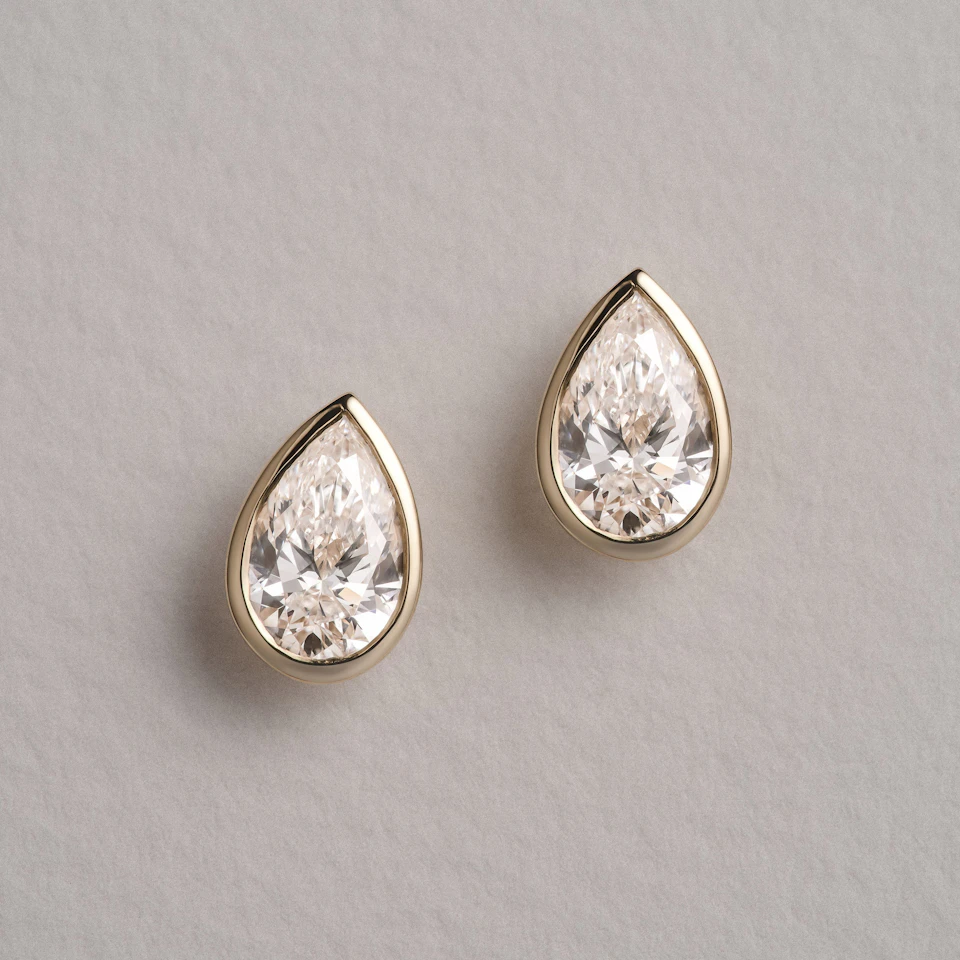 Bezel Set 2.00ct Pear Cut Lab Diamond Stud Earrings in 18K Yellow Gold
