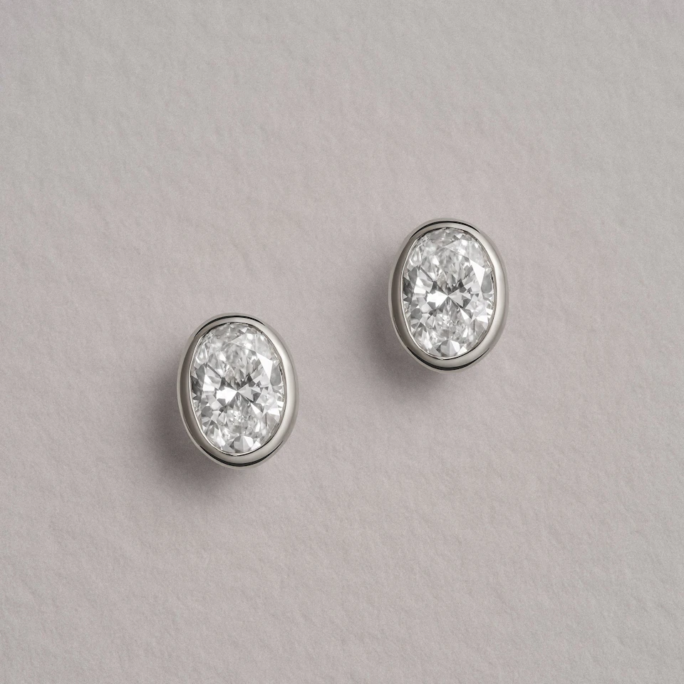 Bezel Set 1.00ct Oval Cut Lab Diamond Stud Earrings in Platinum