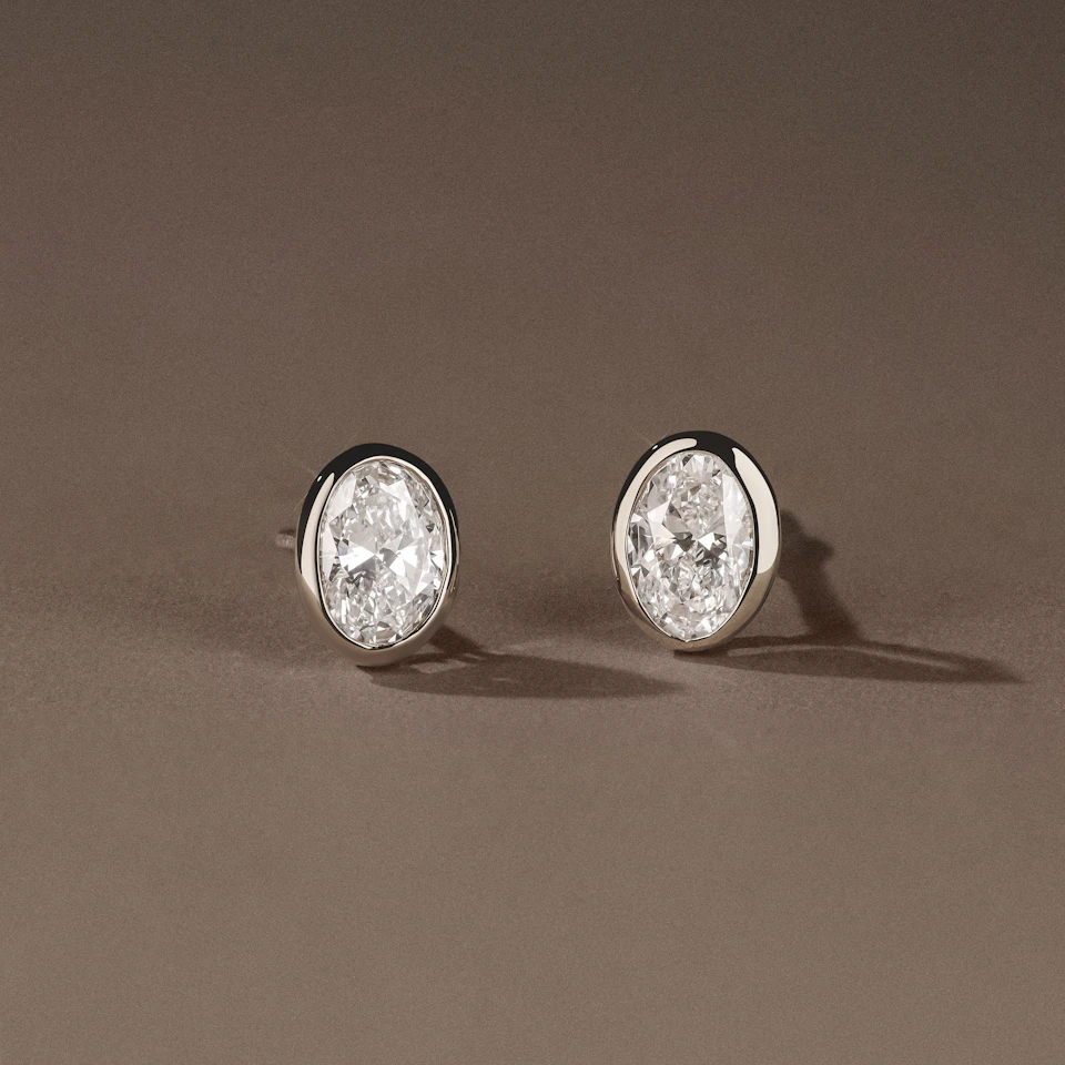 Bezel Set 1.00ct Oval Cut Lab Diamond Stud Earrings in Platinum