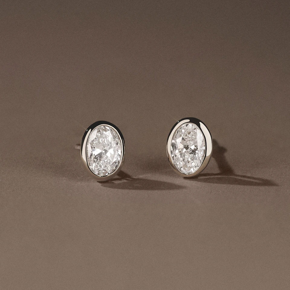 Bezel Set 1.00ct Oval Cut Lab Diamond Stud Earrings in 18K White Gold