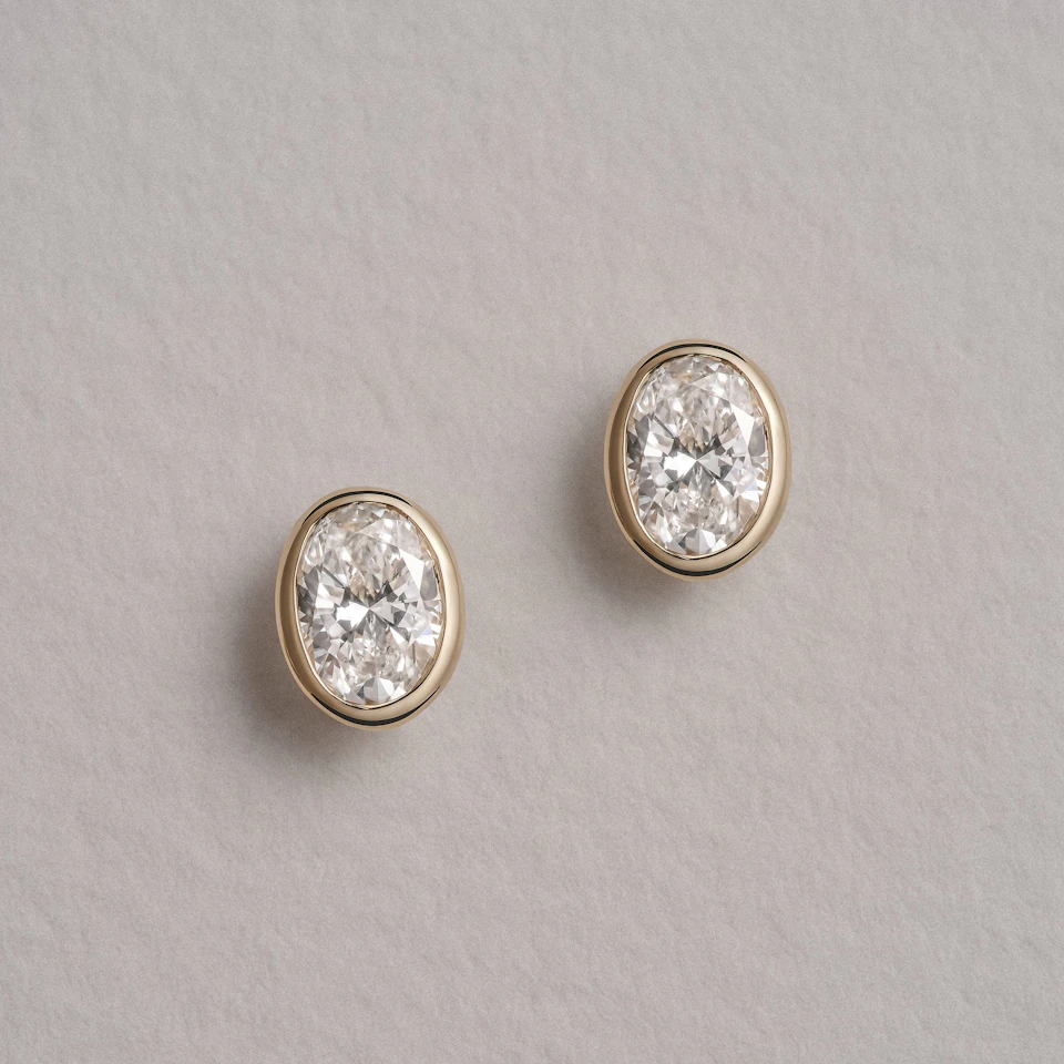 Bezel Set 1.00ct Oval Cut Lab Diamond Stud Earrings in 18K Yellow Gold