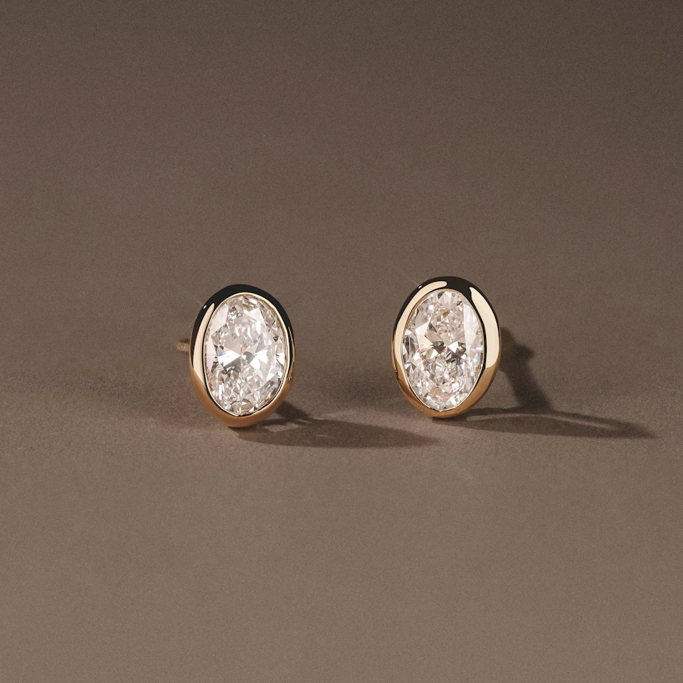Bezel Set 1.00ct Oval Cut Lab Diamond Stud Earrings in 18K Yellow Gold