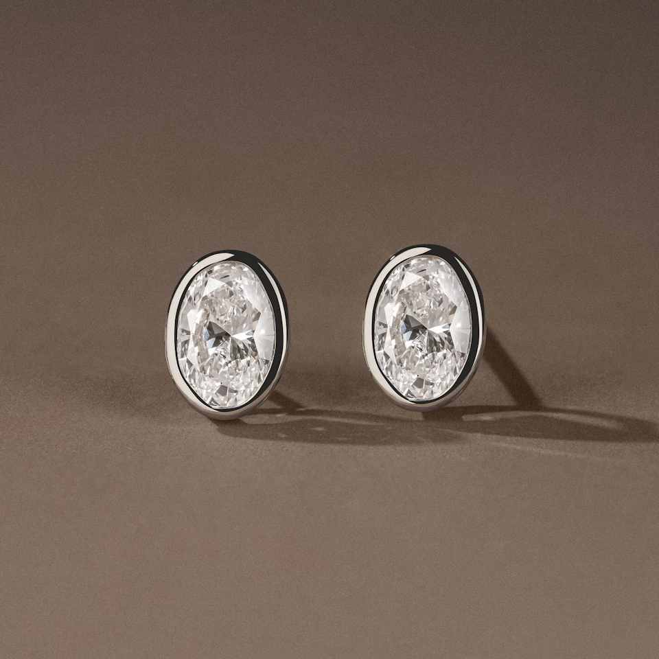 Bezel Set 2.00ct Oval Cut Lab Diamond Stud Earrings in 18K White Gold