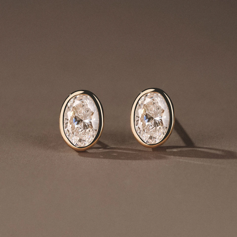 Bezel Set 2.00ct Oval Cut Lab Diamond Stud Earrings in 18K Yellow Gold