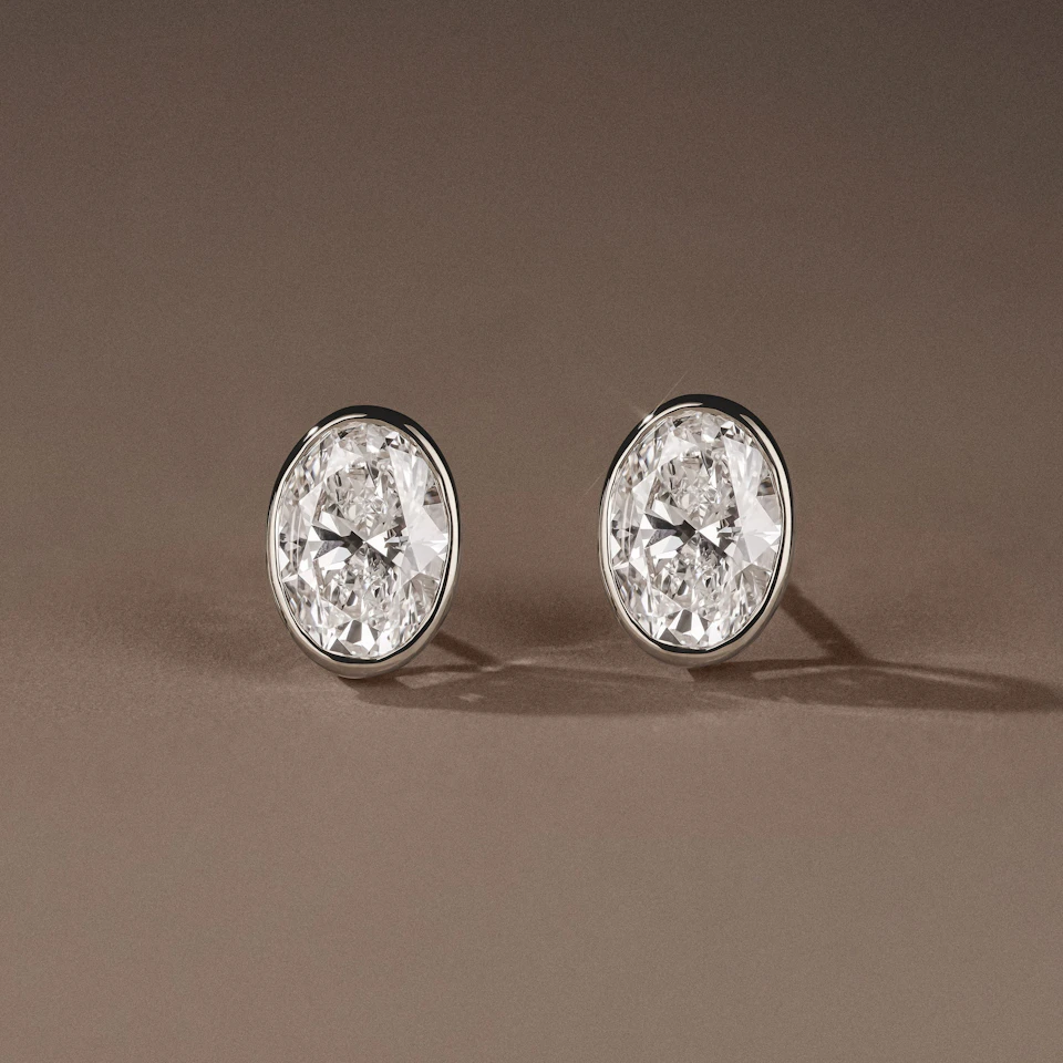 Bezel Set 3.00ct Oval Cut Lab Diamond Stud Earrings in Platinum
