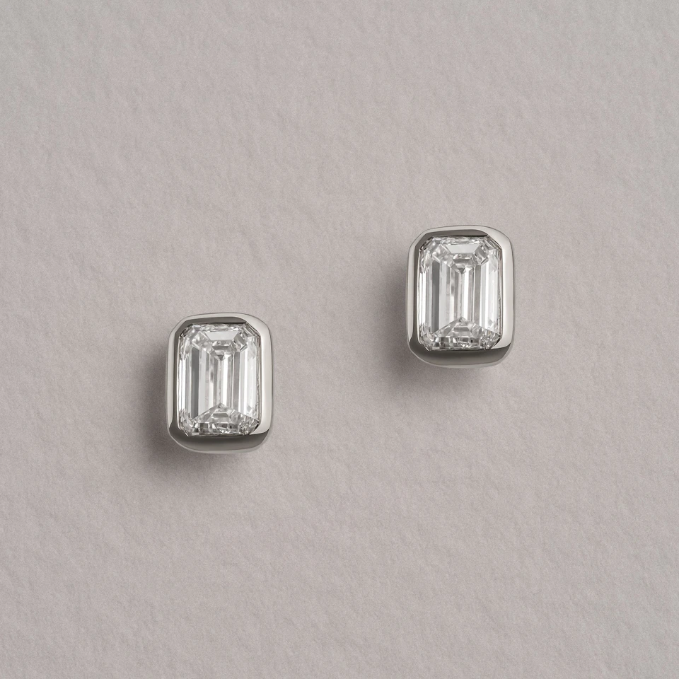 Bezel Set 1.00ct Emerald Cut Lab Diamond Stud Earrings in 18K White Gold