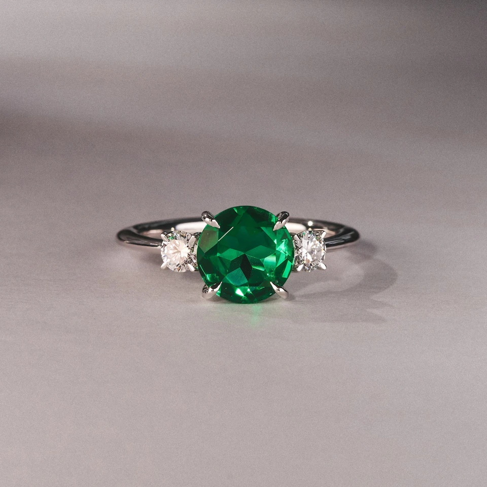 Solene 2.00ct Round Cut Lab Emerald and Lab Diamond 3 Stone Engagement Ring in 18K White Gold