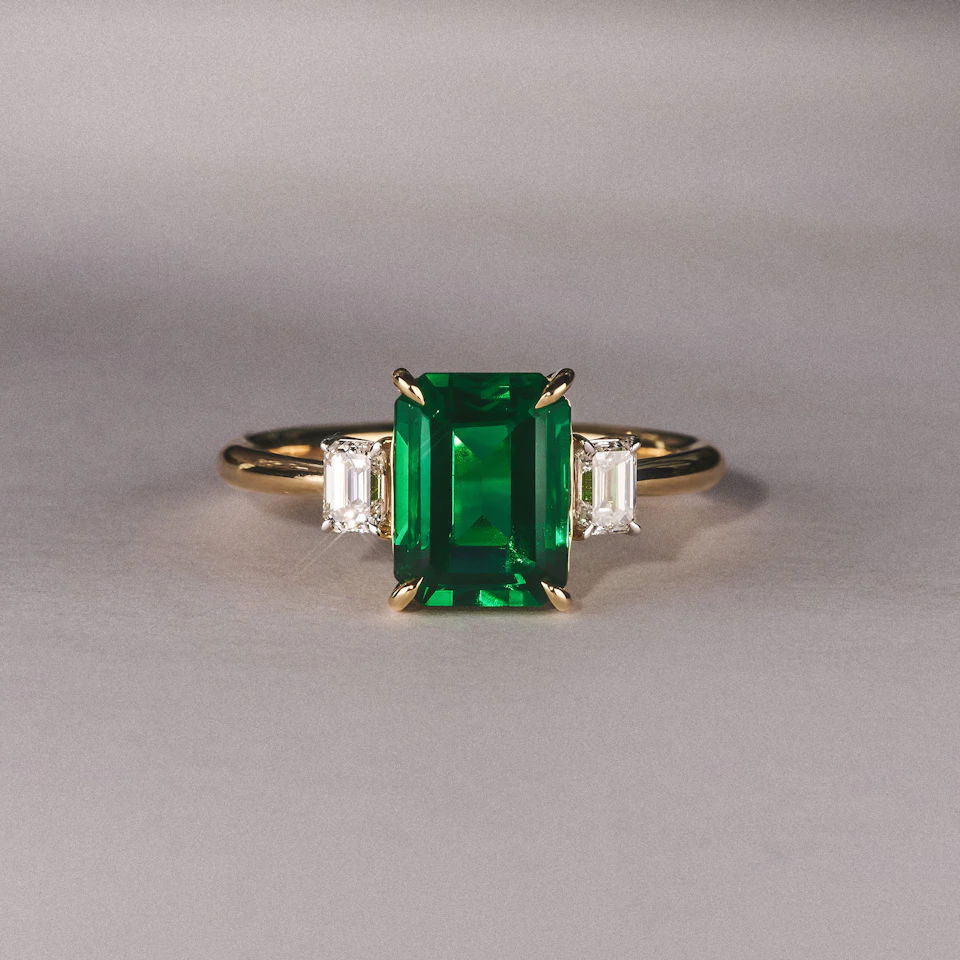 Solene 2.50ct Emerald Cut Lab Emerald and Lab Diamond 3 Stone Engagement Ring in 18K Yellow Gold
