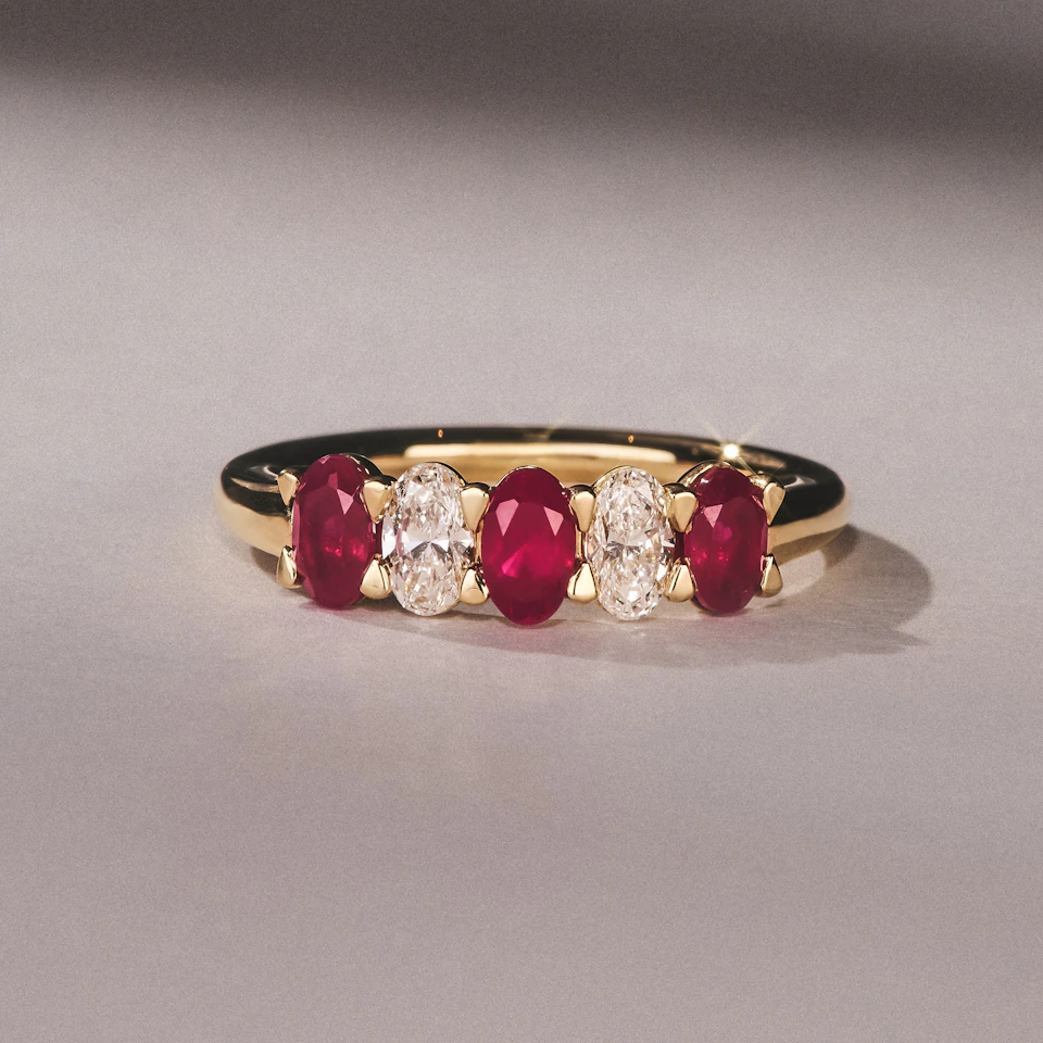 Solene 0.75ct Oval Cut Lab Ruby and Lab Diamond Half Band Eternity Ring in 18K Yellow Gold