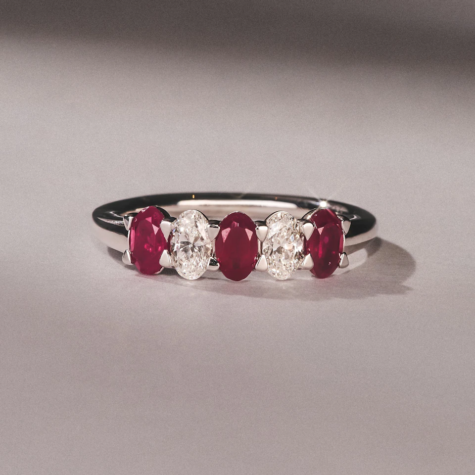 Solene 0.75ct Oval Cut Lab Ruby and Lab Diamond Half Band Eternity Ring in 18K White Gold