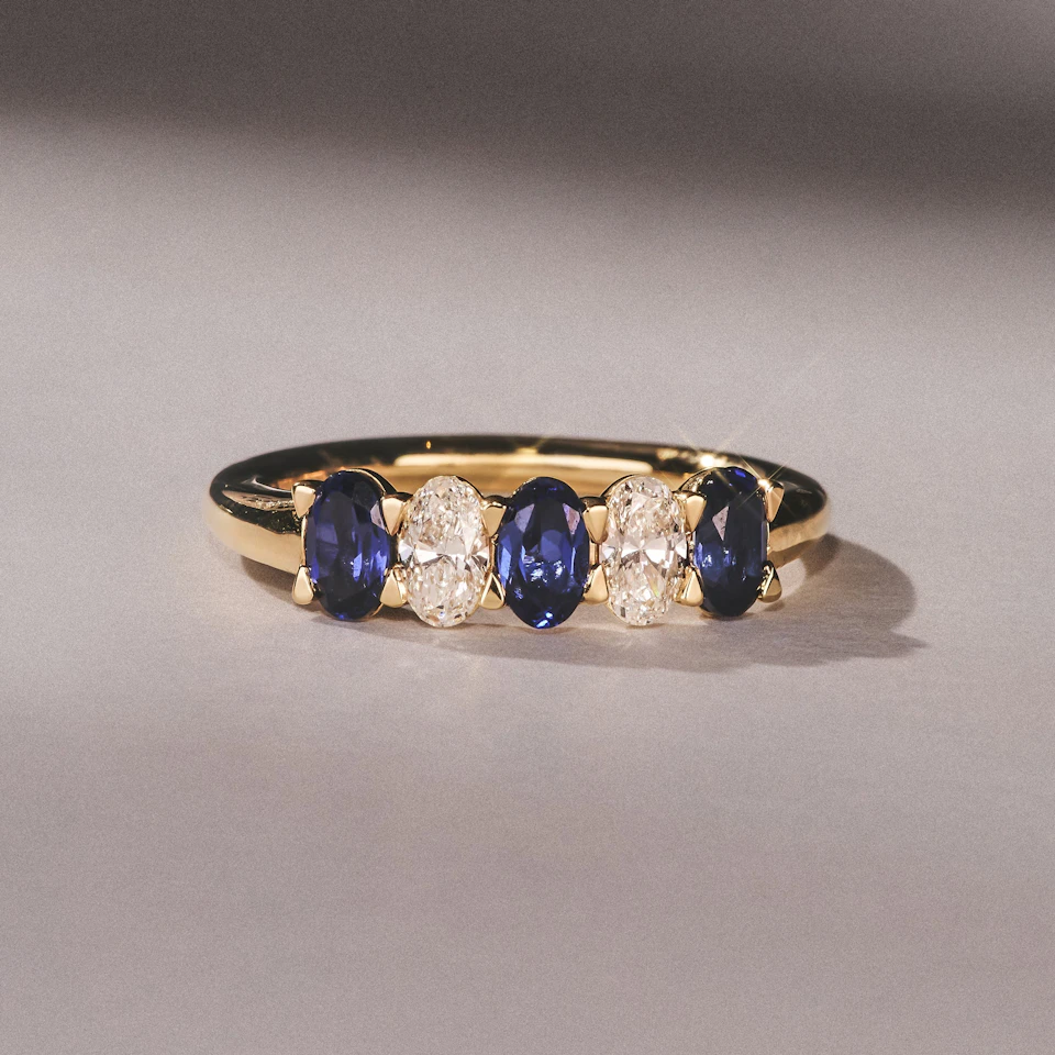 Solene 0.75ct Oval Cut Lab Sapphire and Lab Diamond Half Band Eternity Ring in 18k Yellow Gold