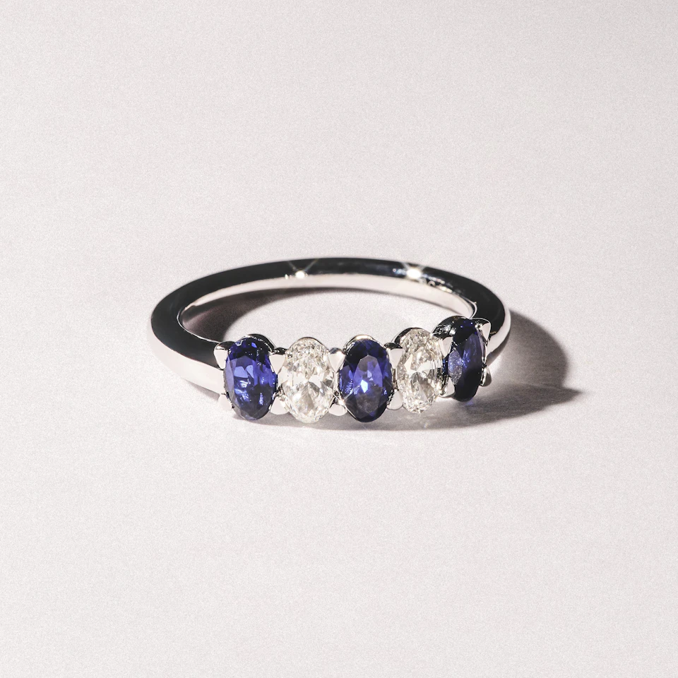 Solene 0.75ct Oval Cut Lab Sapphire and Lab Diamond Half Band Eternity Ring in 18k White Gold