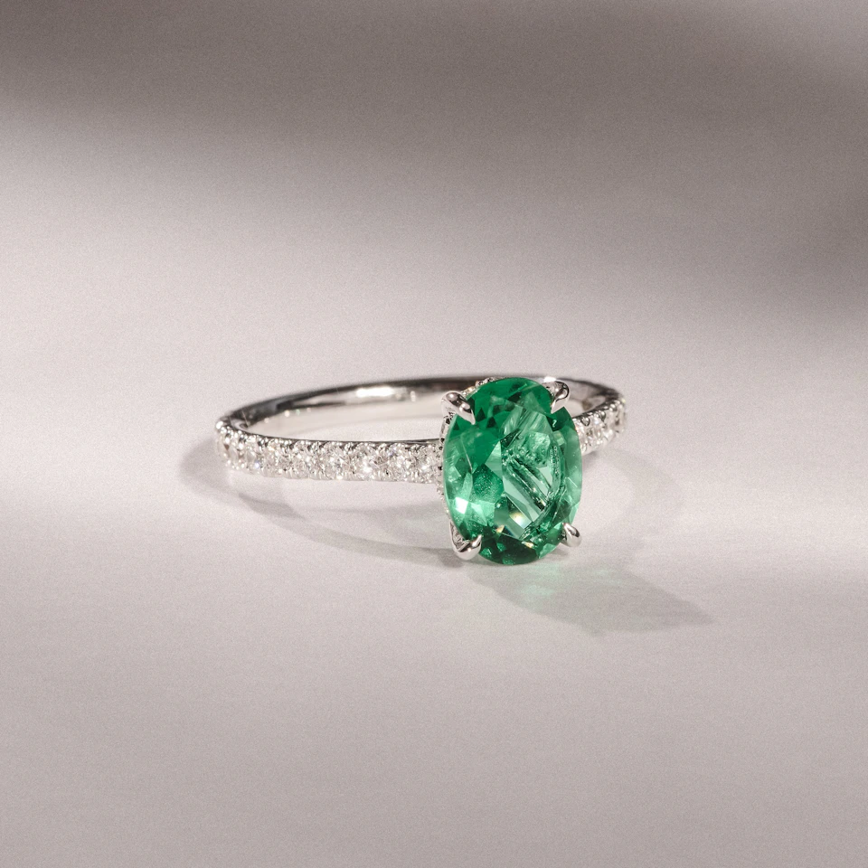 Amora Gem 2.00ct Oval Cut Lab Emerald Hidden Halo Engagement Ring with Side Stones in 18K White Gold