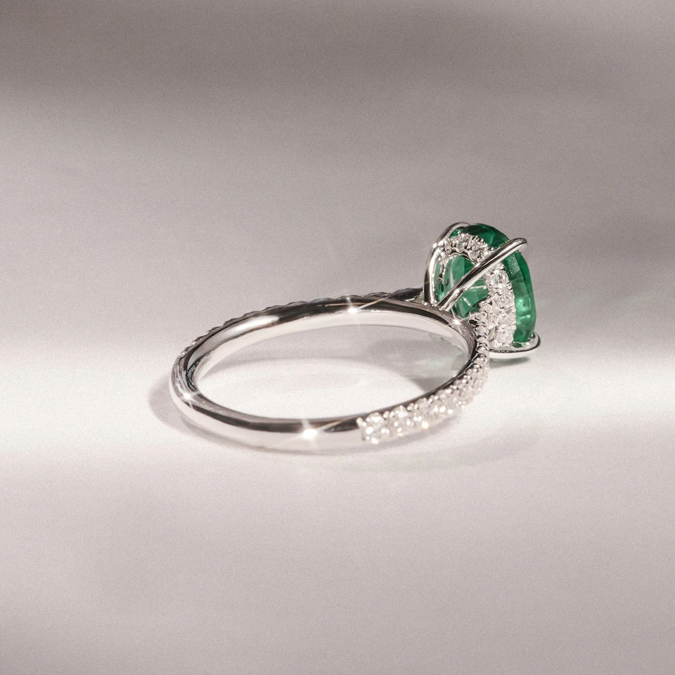 Amora Gem 2.00ct Oval Cut Lab Emerald Hidden Halo Engagement Ring with Side Stones in 18K White Gold
