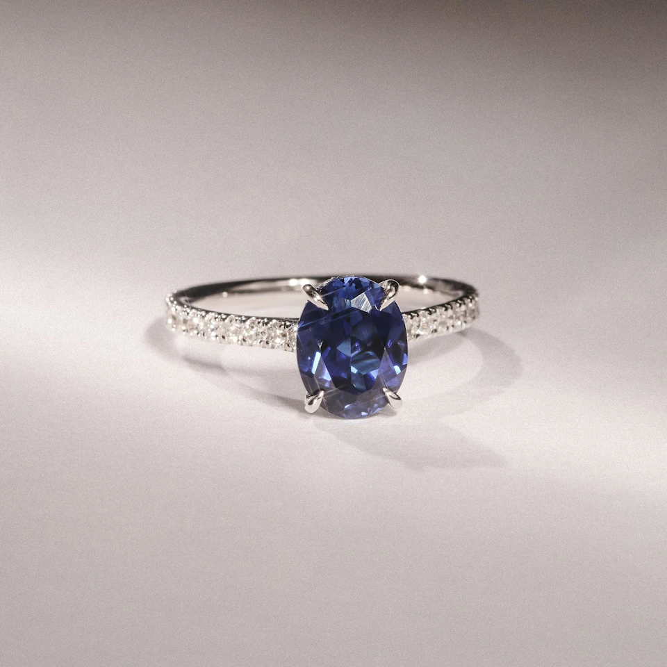 Amora Gem 2.00ct Oval Cut Lab Sapphire Hidden Halo Engagement Ring with Side Stones in 18K White Gold