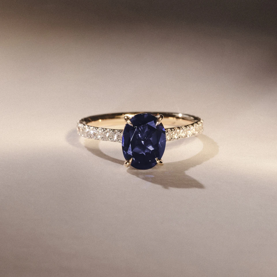 Amora Gem 2.00ct Oval Cut Lab Sapphire Hidden Halo Engagement Ring with Side Stones in 18K Yellow Gold