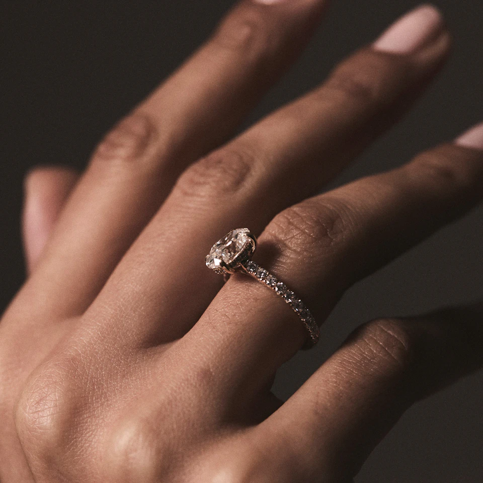 Amora Oval 1.00ct Hidden Halo Diamond Engagement Ring With Side Stones Set in 18K Gold