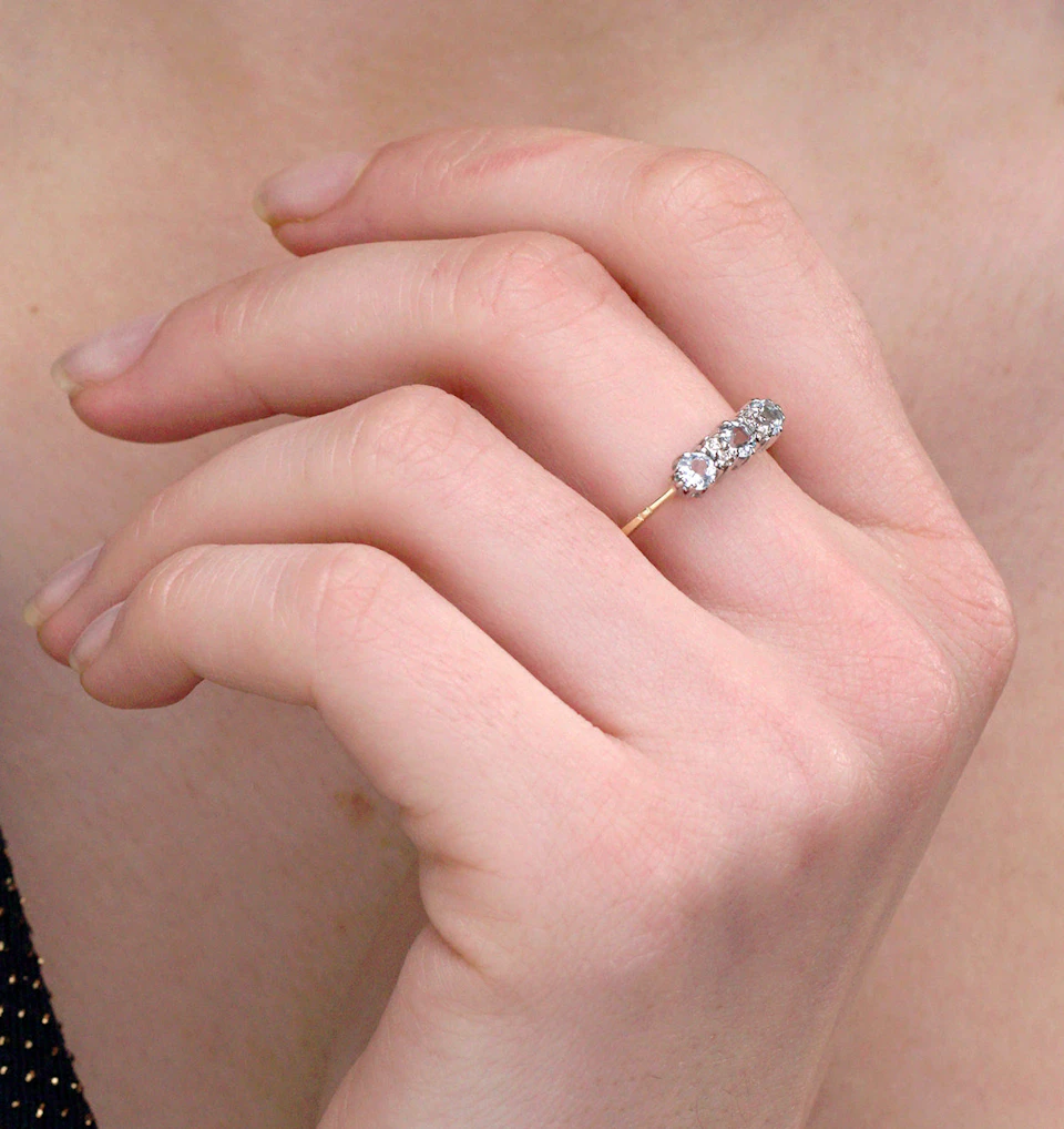 Blue Topaz 0.50CT And Diamond 9K Yellow Gold Ring